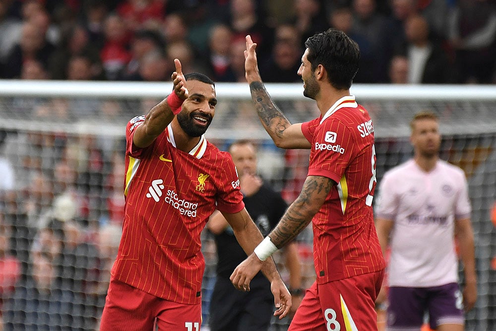 | Photo: AP/Rui Vieira : Premier League 2024-25: Liverpool's Mohamed Salah celebrates with Dominik Szoboszlai, right, after scoring his side's second goal